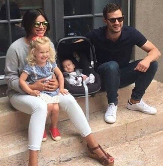 Alberta Dornan's Mom, Amelia Warner, and dad, Jamie Dornan, with her two sisters.